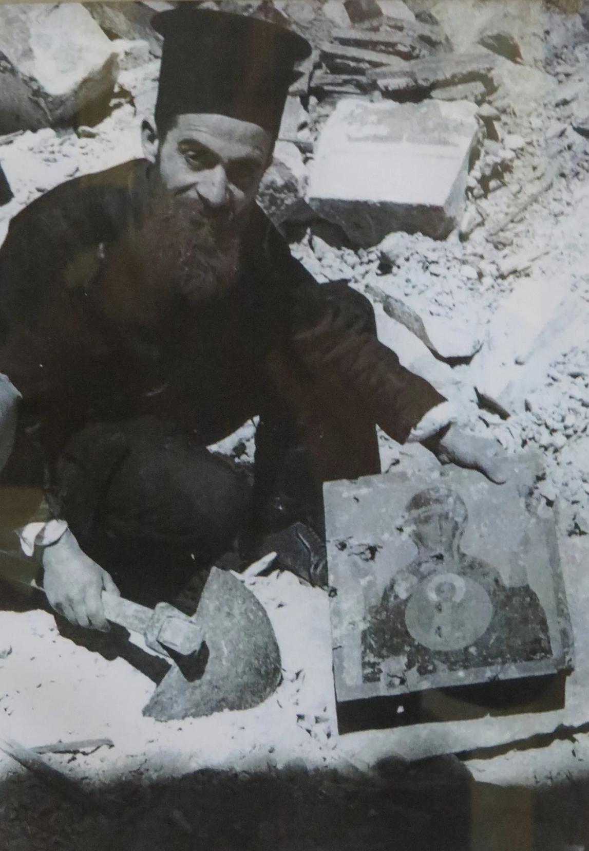 Pap&agrave;s George Schir&ograve; rummaging through the rubble to salvage the little patrimony left after the bombing.