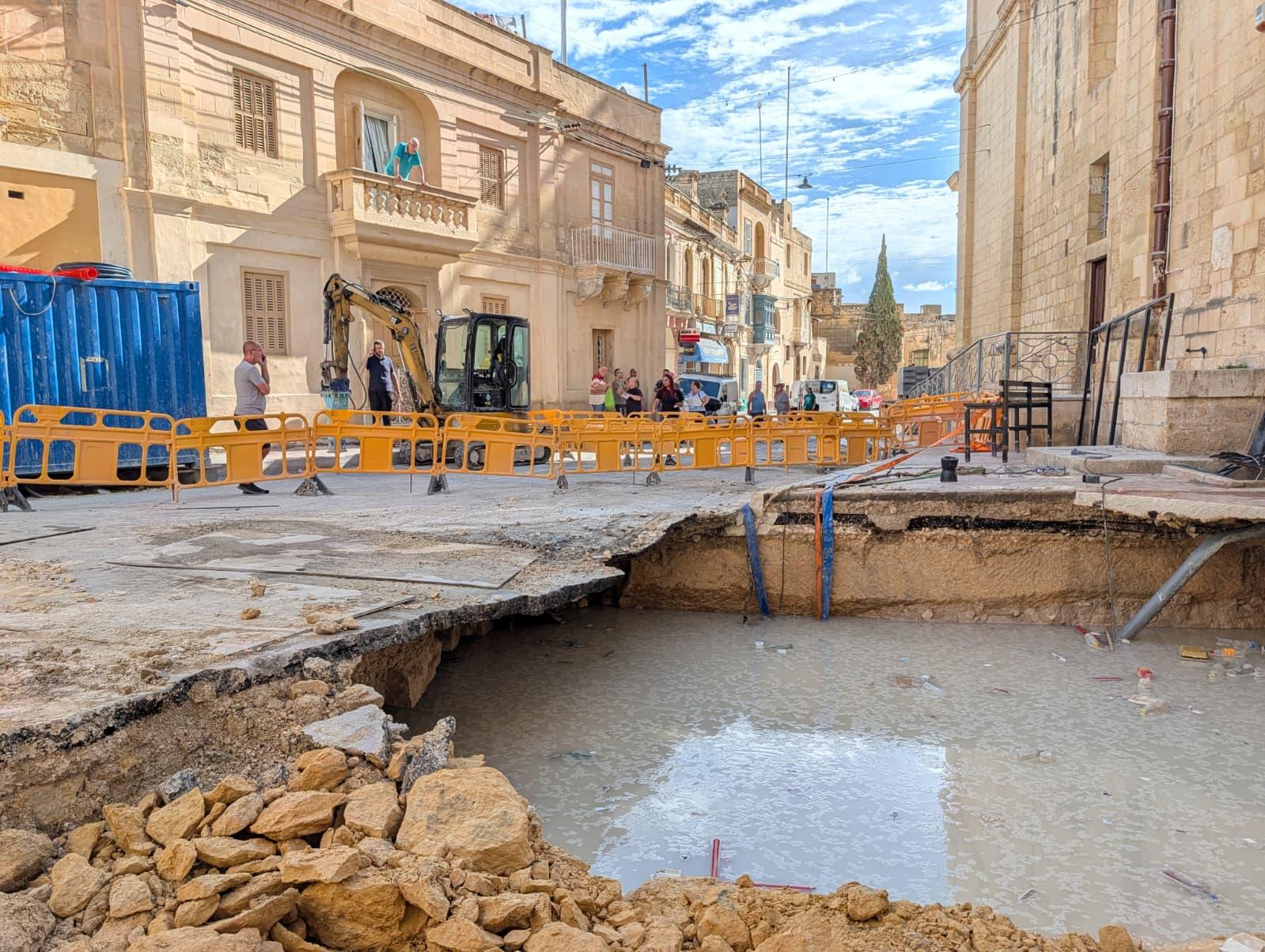 When the road caved, it opened a hole that was filled with rainwater. Photo: Chris Sant Fournier
