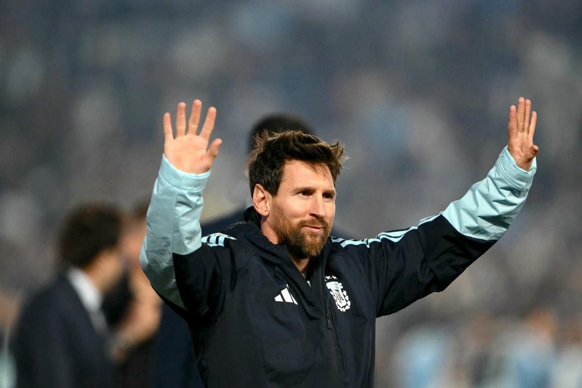 Lionel Messi waves to fans after the tribute international friendly football match between Argentina and Benin.