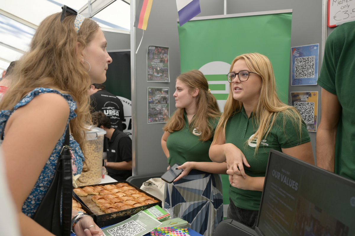 Members of student organisation JEF Malta speaking to students and handing out free pastizzi. Photo: Matthew Mirabelli